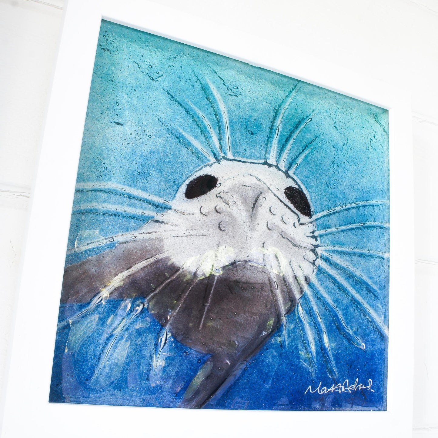 seal face fused glass art frame 25cm 10" blue teal water, underwater animal, animal print, wall art, pictureframe, unique wall art, wall hanging, handmade wall decor, vibrant piece of art, sea animal turquoise decor, sealface with moustache, cute art, seal swimming in deep sea