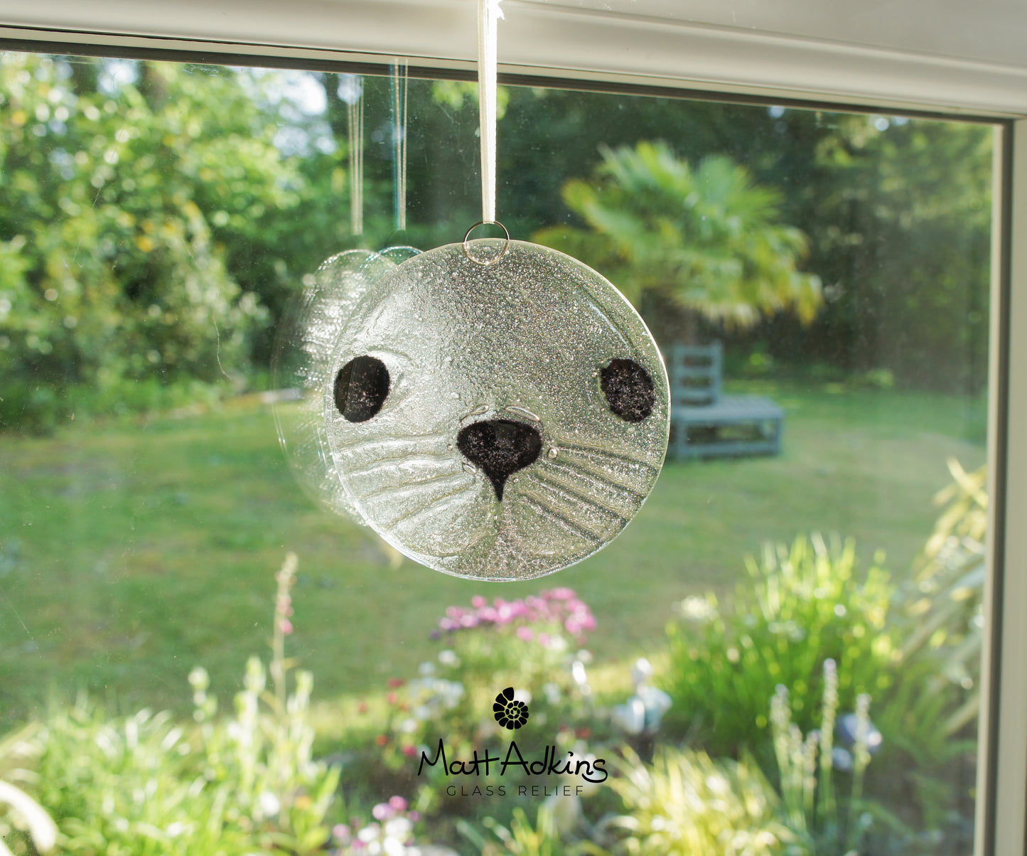 round seal face fused glass clear and black suncatcher 12cm or 5"