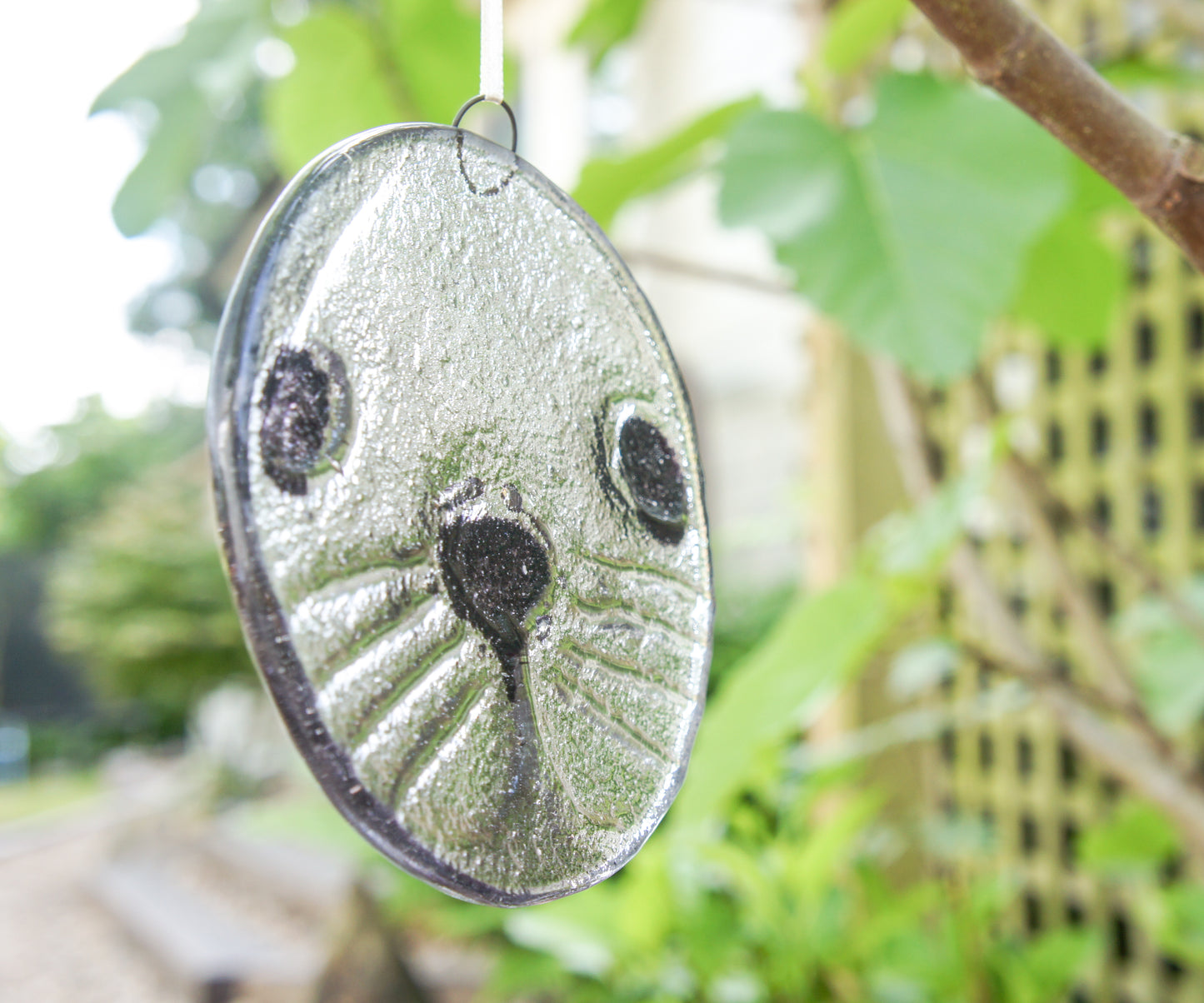 round seal face fused glass clear and black suncatcher 12cm or 5"