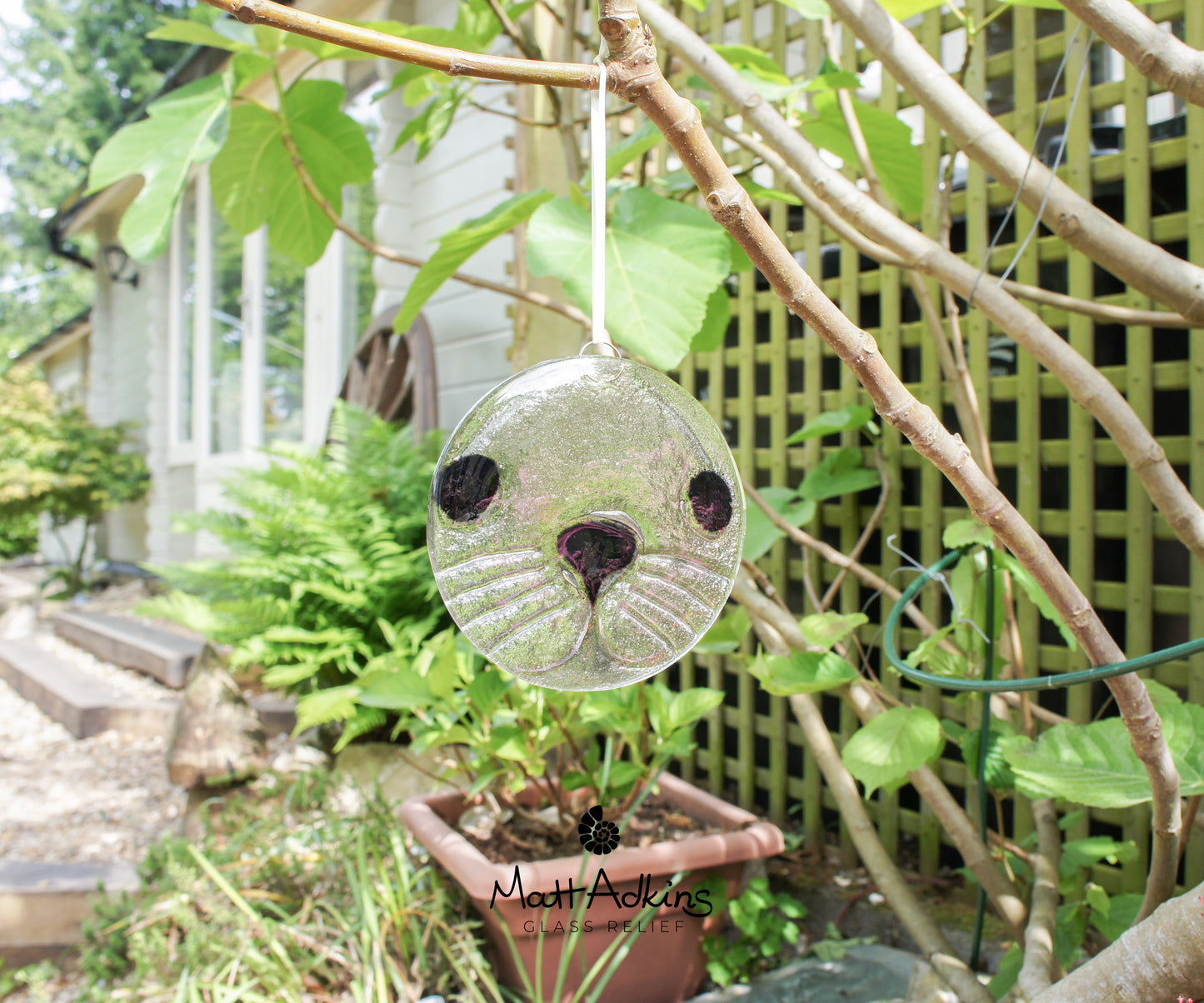 round seal face fused glass clear and black suncatcher 12cm or 5"