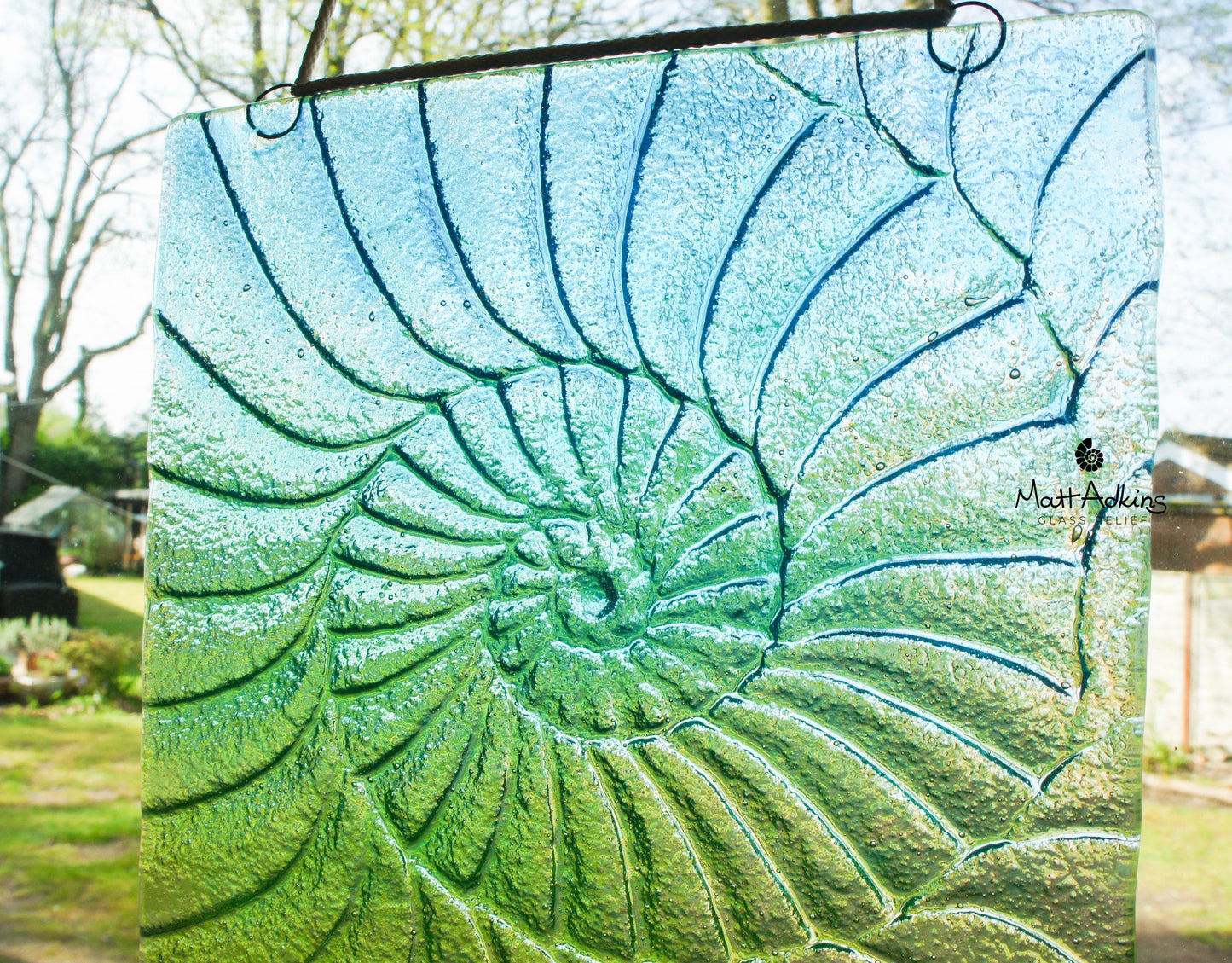 green handmade ammonite suncatcher