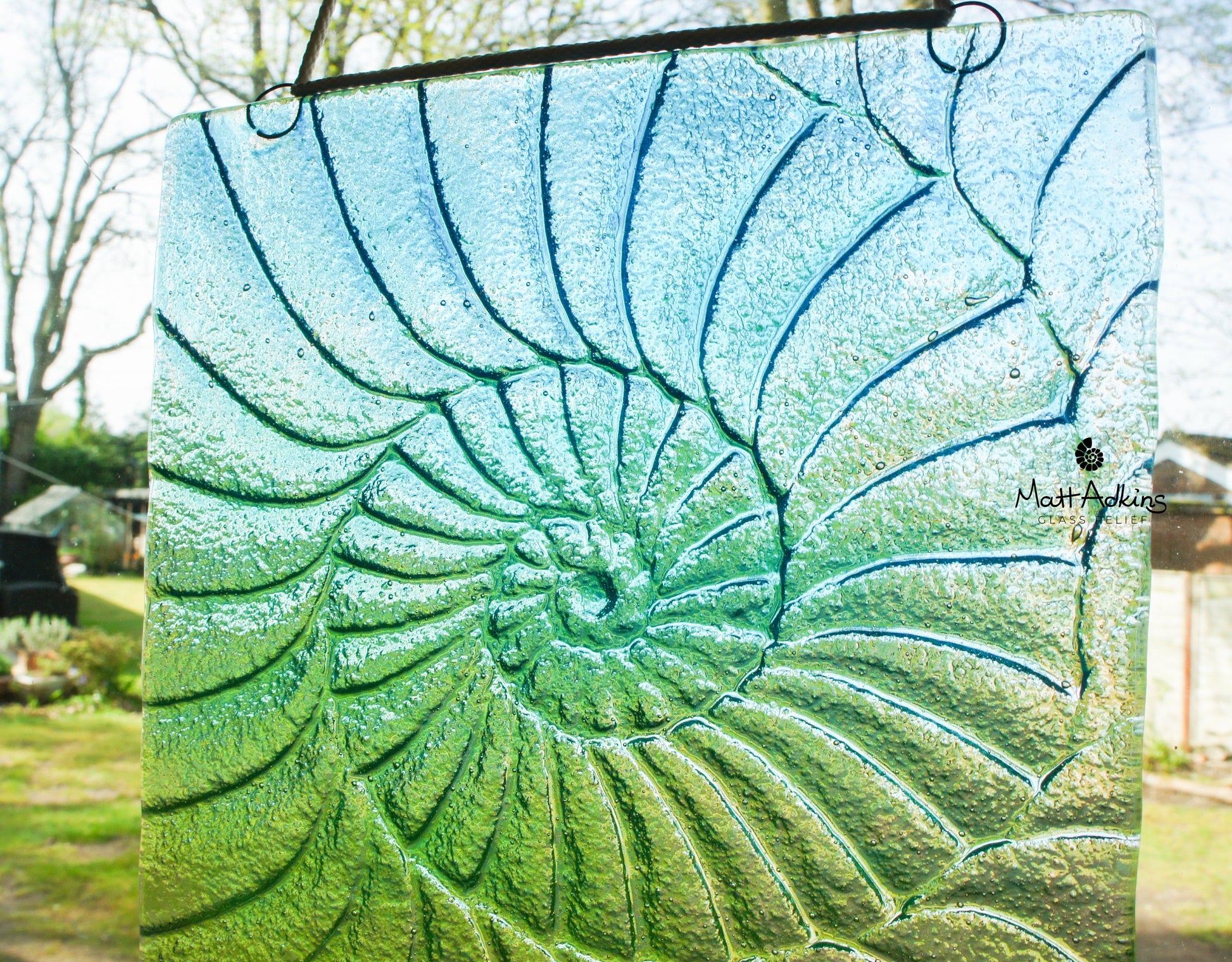 green handmade ammonite suncatcher