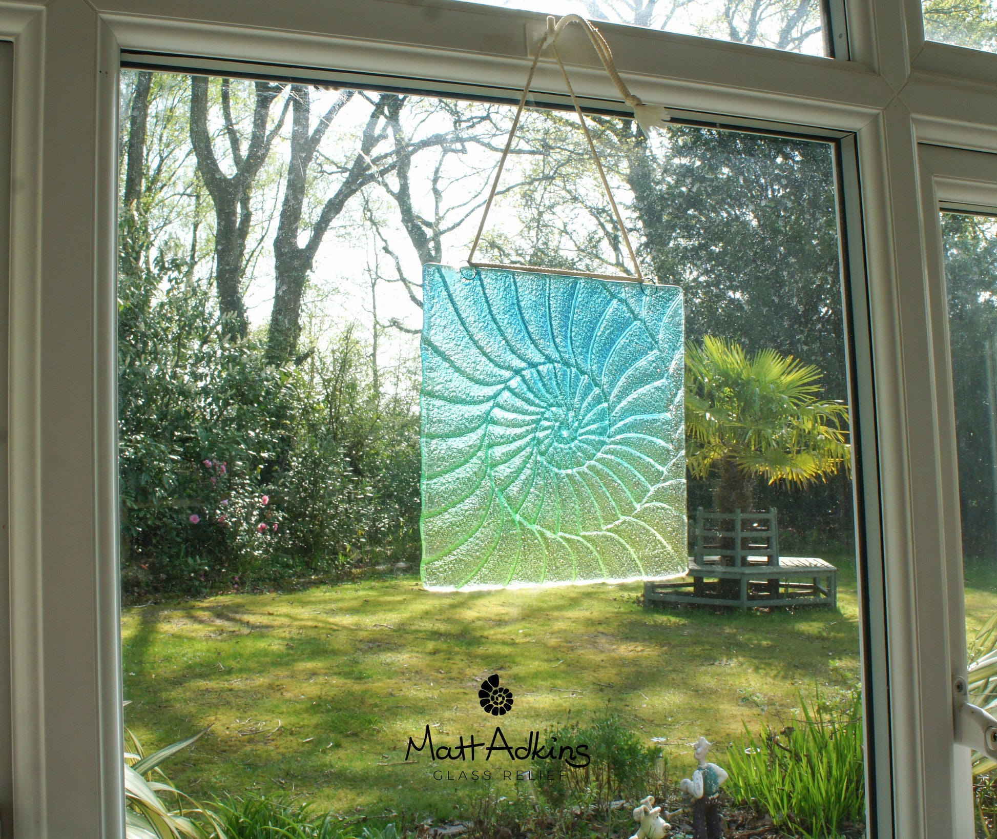 teal green textured glass suncatcher fossil hanging