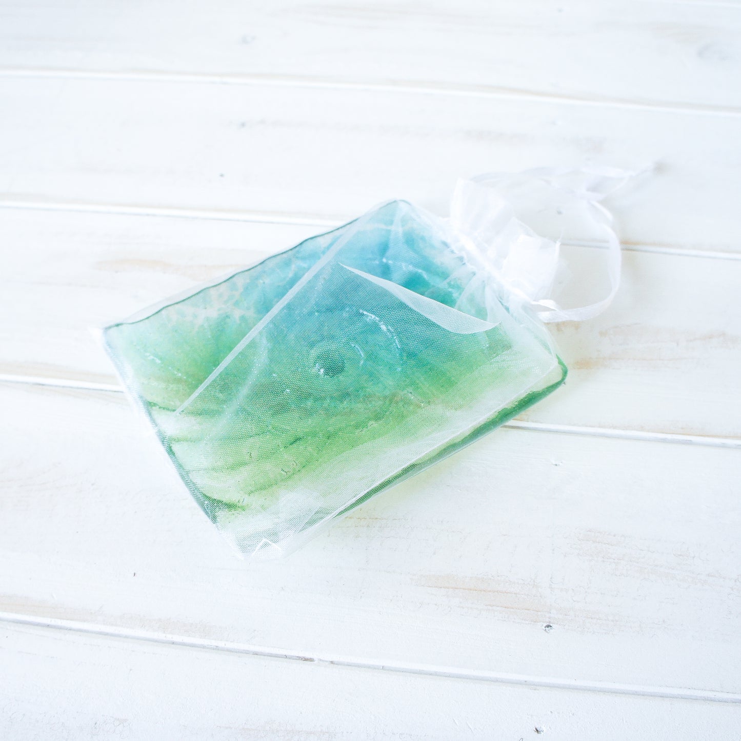 ammonite teal and lime green handmade fused glass soap dish in organza bag
