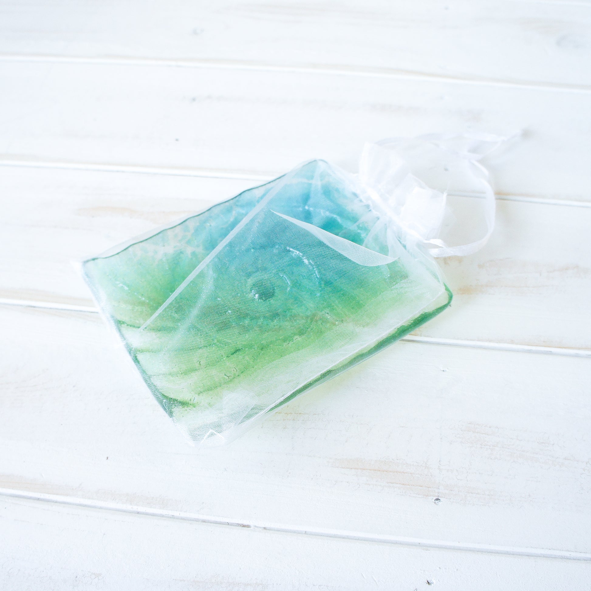 ammonite teal and lime green handmade fused glass soap dish in organza bag