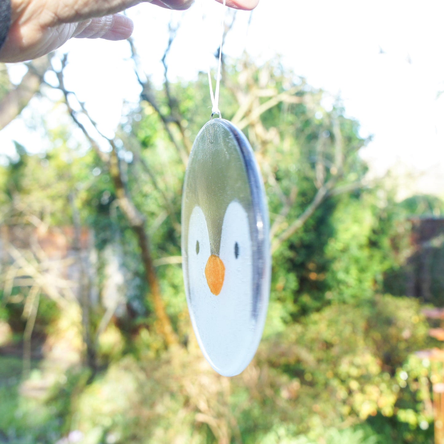 penguin fused glass round hanging ornament with ribbon