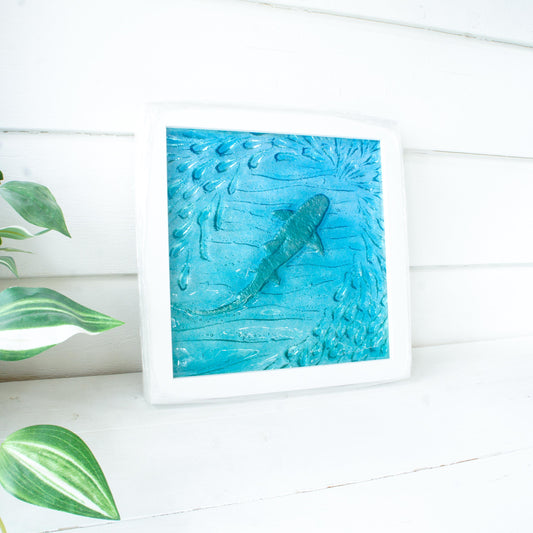 shark fused glass picture frame with silver shimmering shark in teal blue sea surrounded by shoal of fish square frame at 25cm (10")