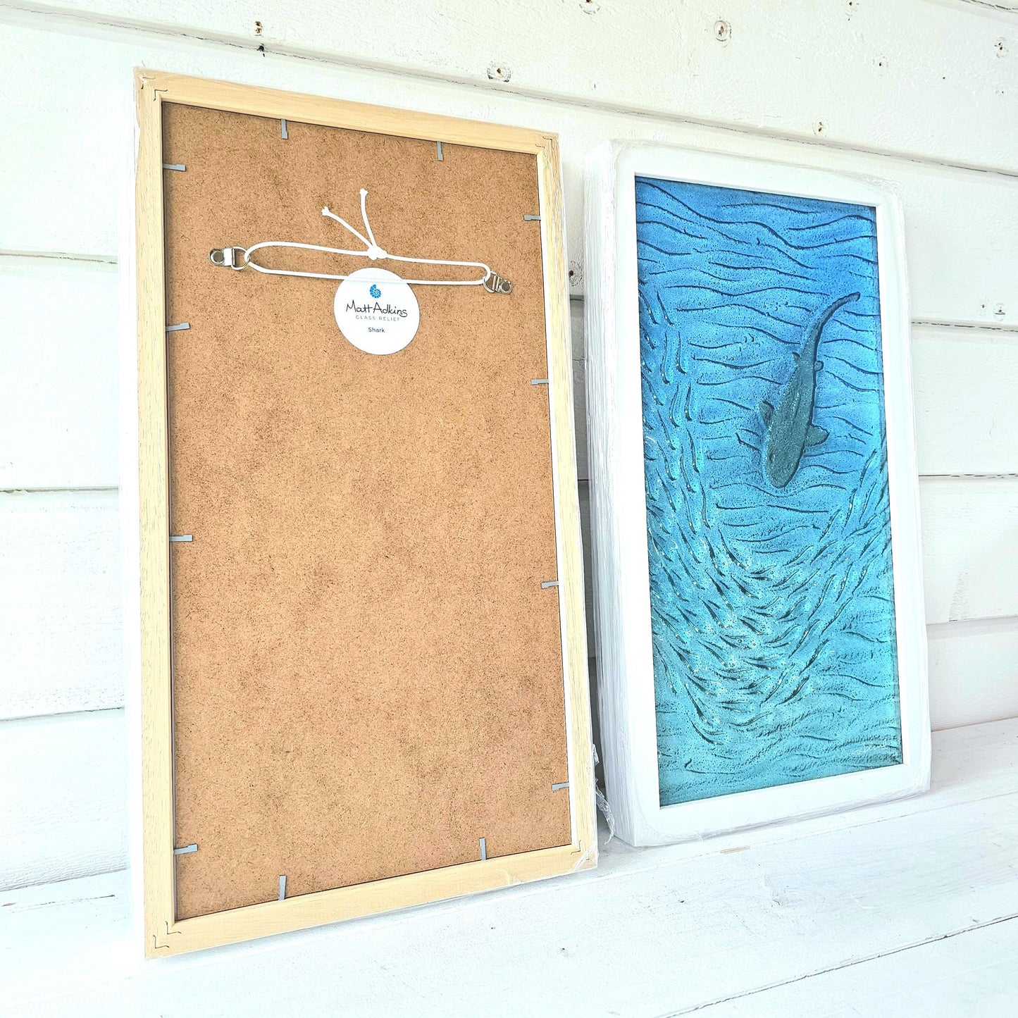 back of framed art with sticker and cord to hang 25x45cm